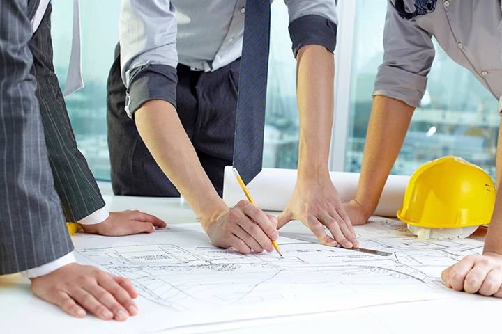 Architects hands sketching a housing project