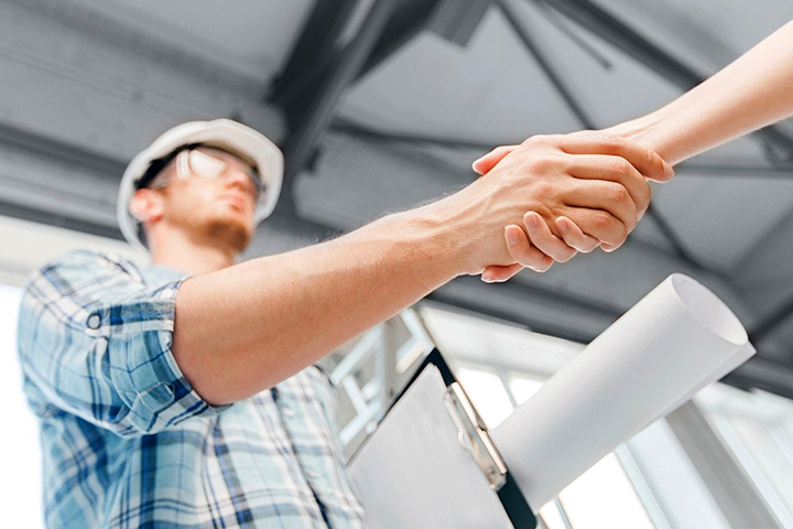 Civil engineer hand shaking with client